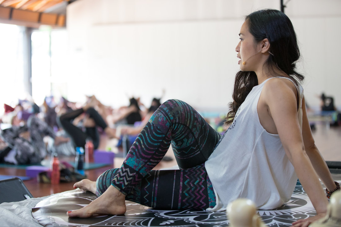 Yin, Roll and release yoga class at Sanctuary Festival - Glute massage